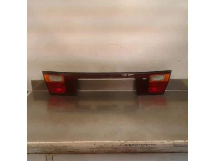 Reflector tail light garnish panel Mazda 323
