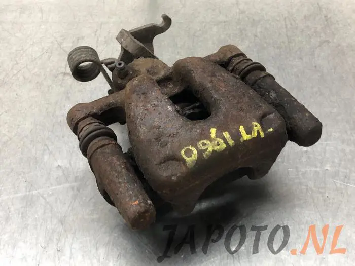 Rear brake calliper, left Mitsubishi Colt